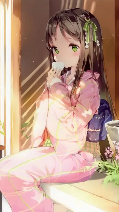 Girl in pink kimono drinks tea