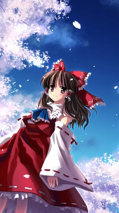 Girl in red kimono under cherry blossoms