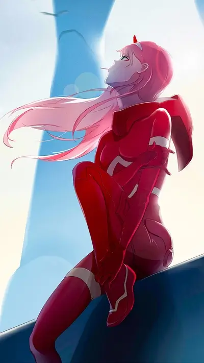 Girl in red suit sitting on a ledge