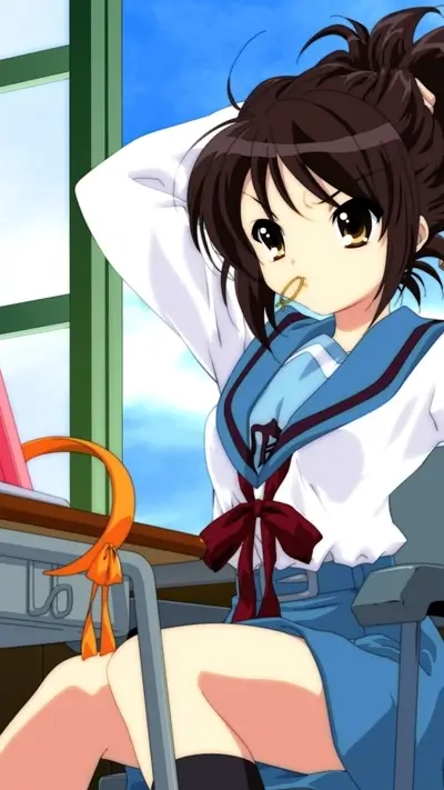 Girl in school uniform sits at desk