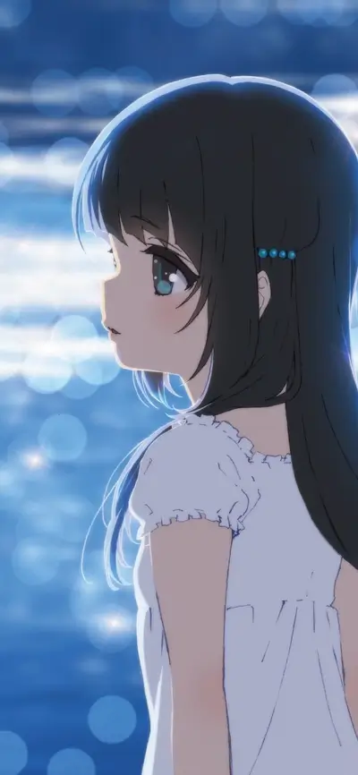 Girl in white dress looking at the water