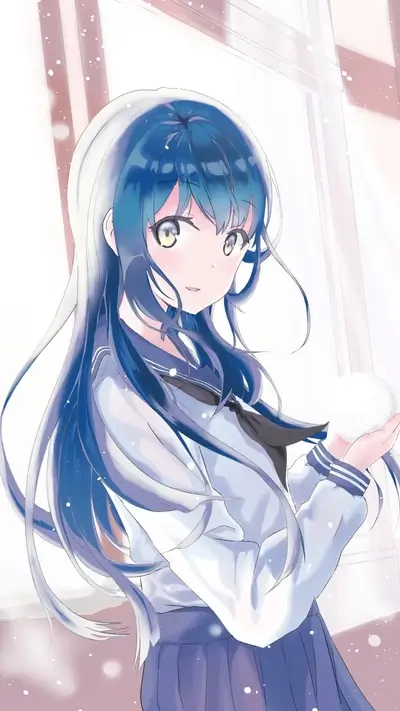 Girl in winter uniform holding snowball