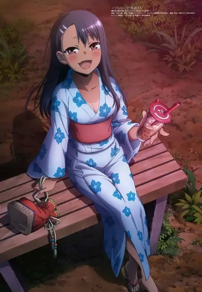 Girl in yukata sitting on a bench