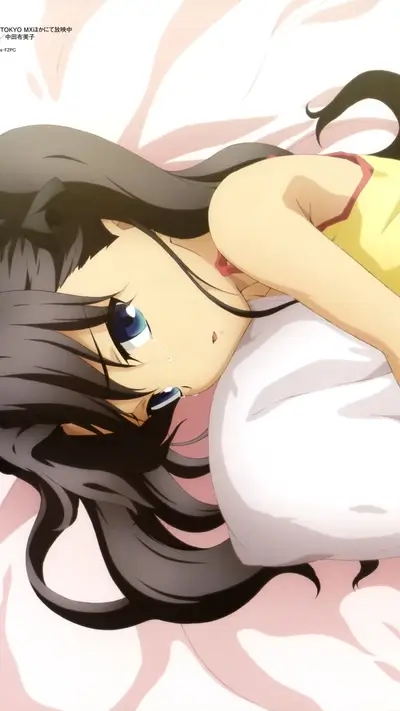 Girl laying in bed, tears rolling down her face