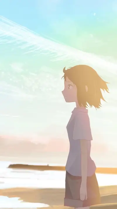 Girl looking at the ocean at sunset