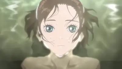Girl looking up from underwater with bubbles