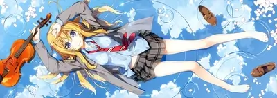 Girl lying on her back playing violin in the sky