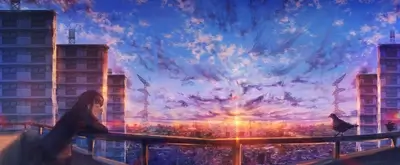 Girl on balcony overlooking city sunset