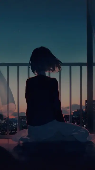 Girl sitting alone at night looking at city lights
