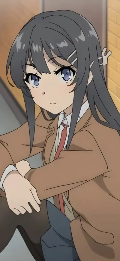 Girl sitting, brown coat, gray hair