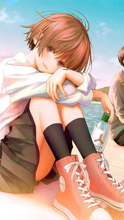 Girl sitting by the sea, holding a drink
