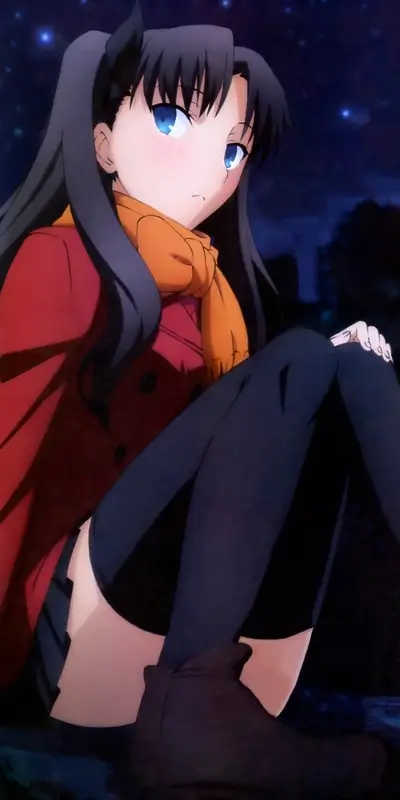 Girl sitting down in a coat, night scene