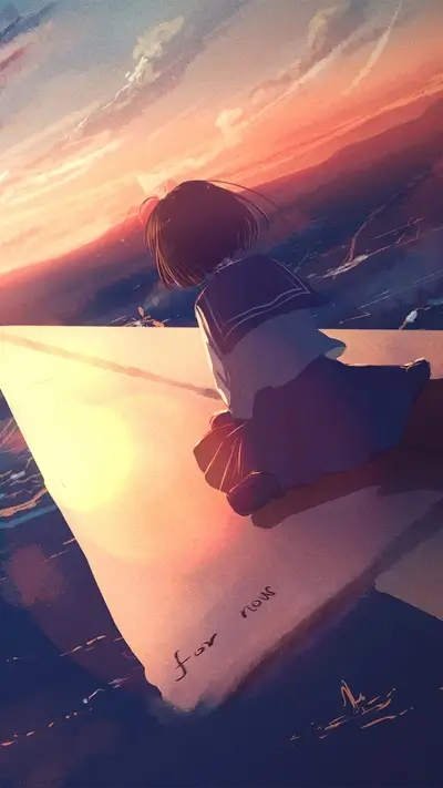 Girl sitting on a paper plane at sunset