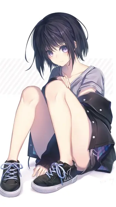 Girl sitting on the floor wearing sneakers