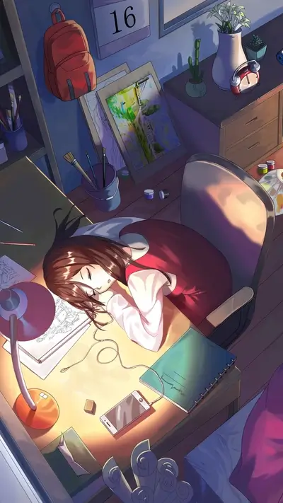 Girl sleeping on her desk surrounded by art supplies