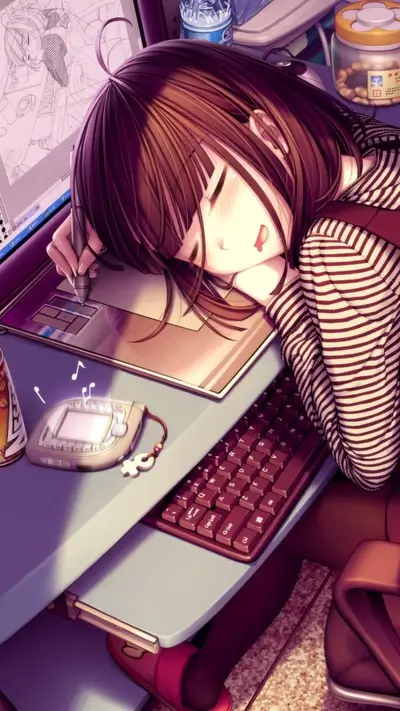 Girl sleeping on her desk while working on her drawing tablet