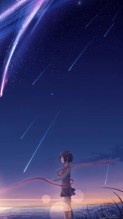 Girl standing by the ocean, watching shooting stars