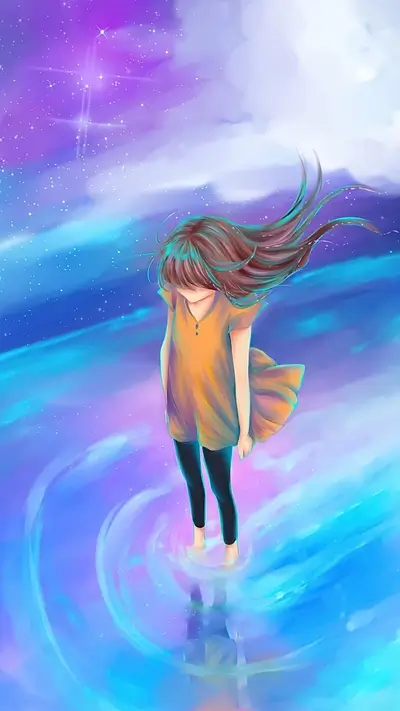 Girl standing in a dreamy, colorful ocean