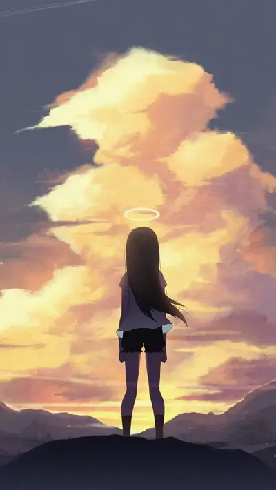 Girl standing on a hill at sunset
