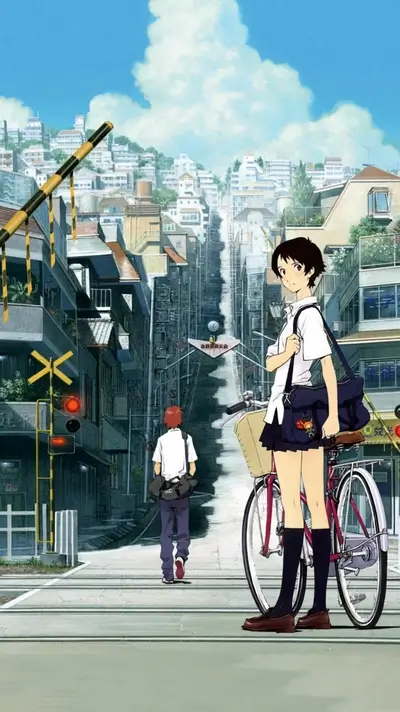 Girl standing with bicycle at railway crossing looking back