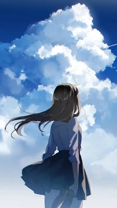 Girl stands with her back to the camera, looking at the sky