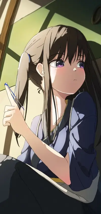 Girl tying her hair up with a rubber band