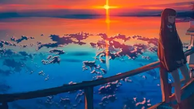 Girl watching sunset over water