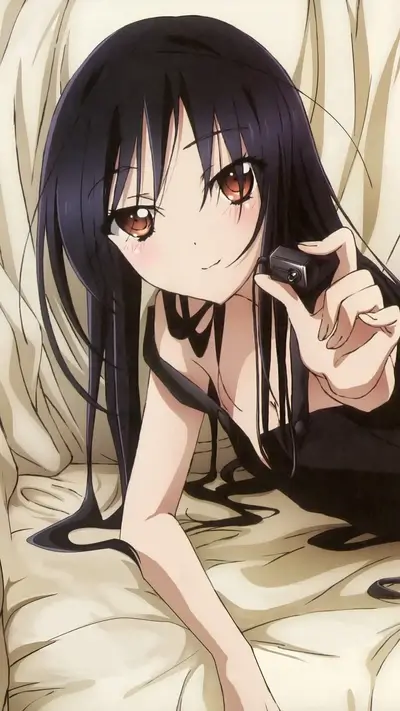 Girl with dark hair holding a small device