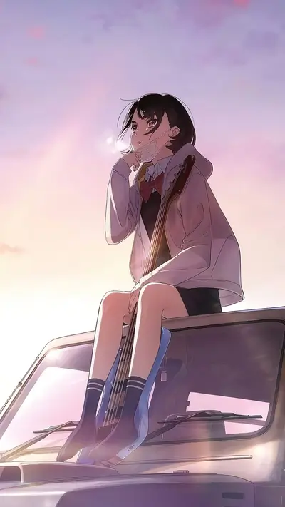 Girl with guitar sitting on car hood, sunset