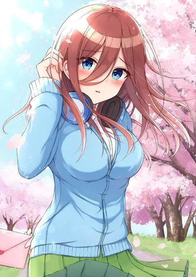 Girl with headphones in a cherry blossom garden