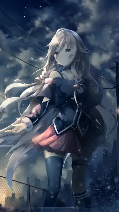 Girl with long hair standing on a rooftop at night