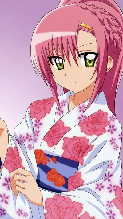 Girl with pink hair wearing a floral kimono smiles sweetly.