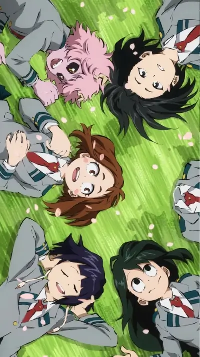 Girls lying on the grass in a circle