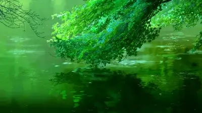 Green foliage hanging above calm reflective water with gentle ripples