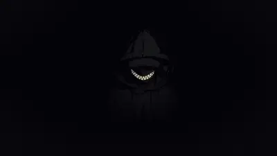 Hooded figure with sharp teeth in darkness