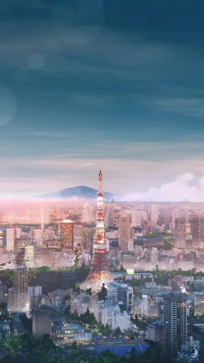 Iconic Tokyo Tower majestically stands amidst the cityscape, skyline and mountain silhouette