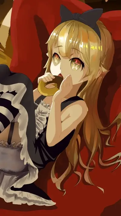 Laying on red couch with a donut