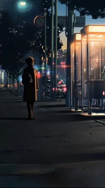 Lonely figure walking away from a telephone booth at night
