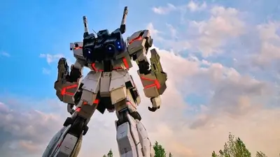 Massive robot towers with glowing accents under a vibrant cloudy sky
