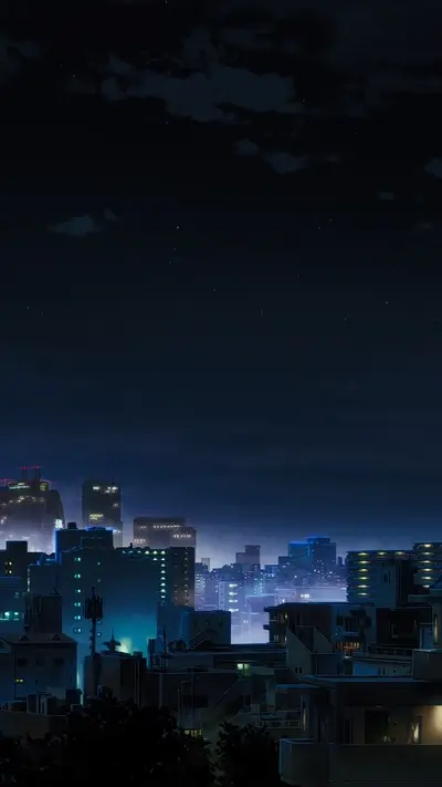 Night cityscape with tall buildings and a dark sky