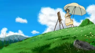 Painting on a grassy hill under a white umbrella