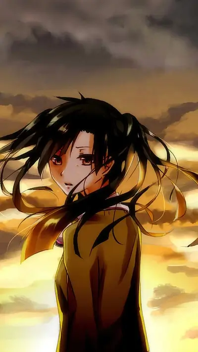 Pensive girl with pigtails against dramatic golden sky
