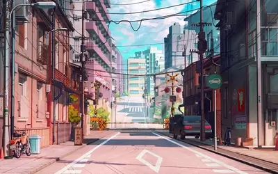Quiet street scene in Japan with buildings and telephone poles.