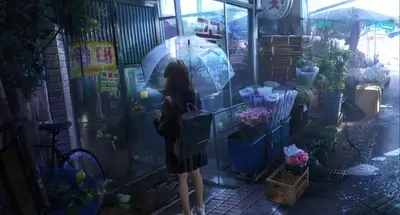 Rainy day at a flower shop, figure of a young woman with an umbrella