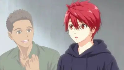 Red-haired young man looking surprised next to his smiling friend