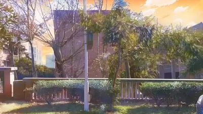 Residential building in a garden setting during sunset