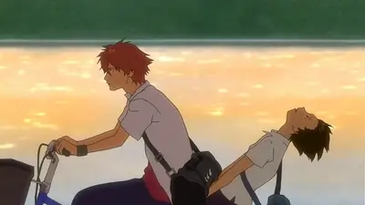 Riding a bicycle along a river during sunset