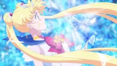 Sailor Moon with long blonde hair, bright blue magical energy