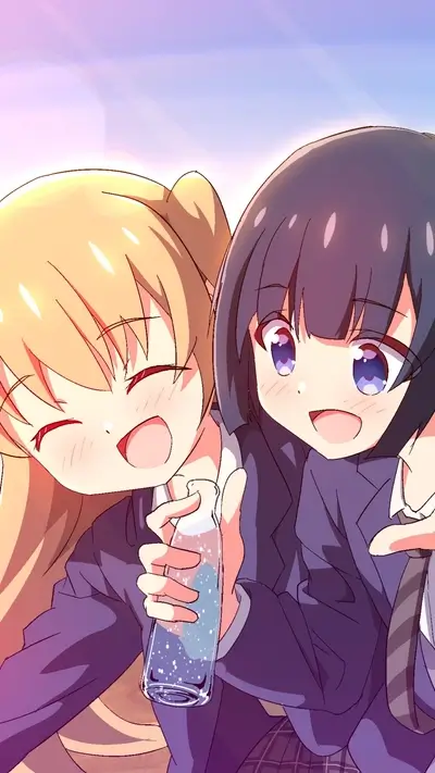 School girls sharing a drink, big smiles and friendship on full display