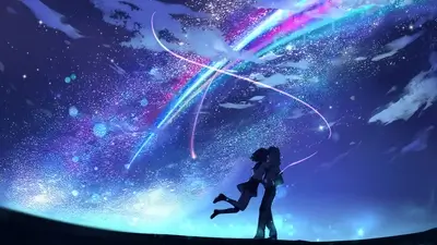Silhouette of a couple hugging under a vibrant starry night sky with a colorful meteor